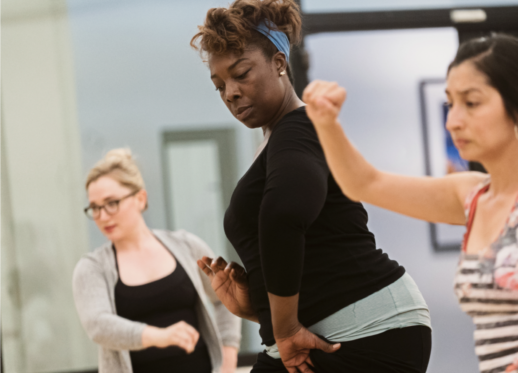 Three student dancers in a class